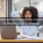 Woman looking at her laptop computer reading how to find merged cells in Excel