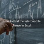 Hand writing a lesson on how to find the interquartile range in Excel on a chalkboard